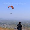 boy clicks photo of paragliding