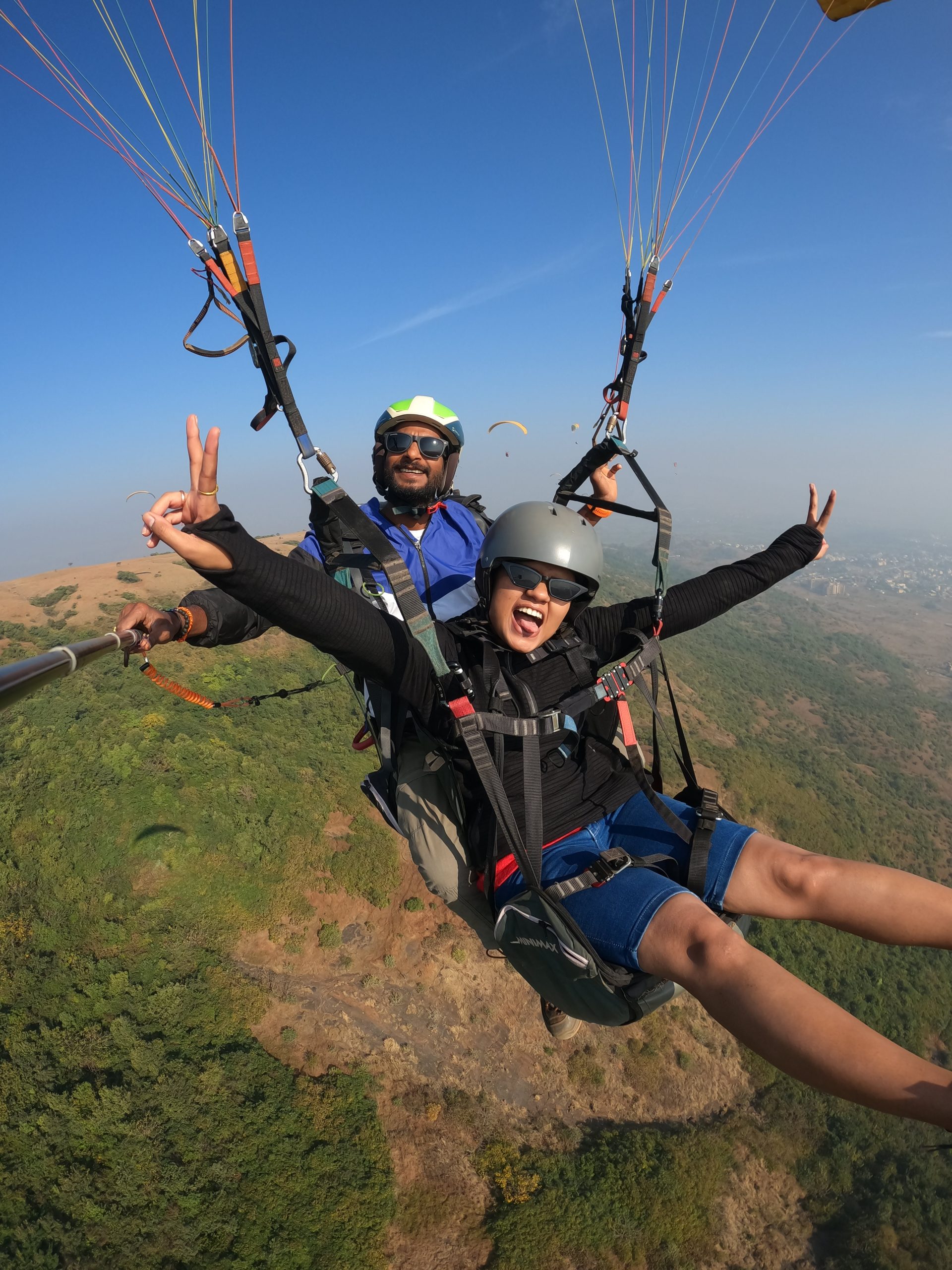 a man and woman in parachutes